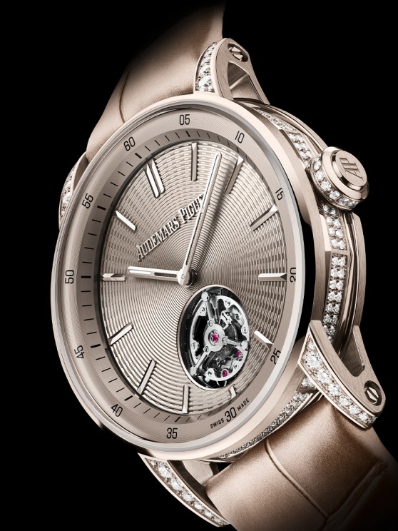 The new 38 mm Code 11.59 by Audemars Piguet Flying Tourbillon offers an elegant aesthetic with its 18-carat sand gold case set with brilliant-cut diamonds, sand gold-toned dial and beige alligator strap © Audemars Piguet